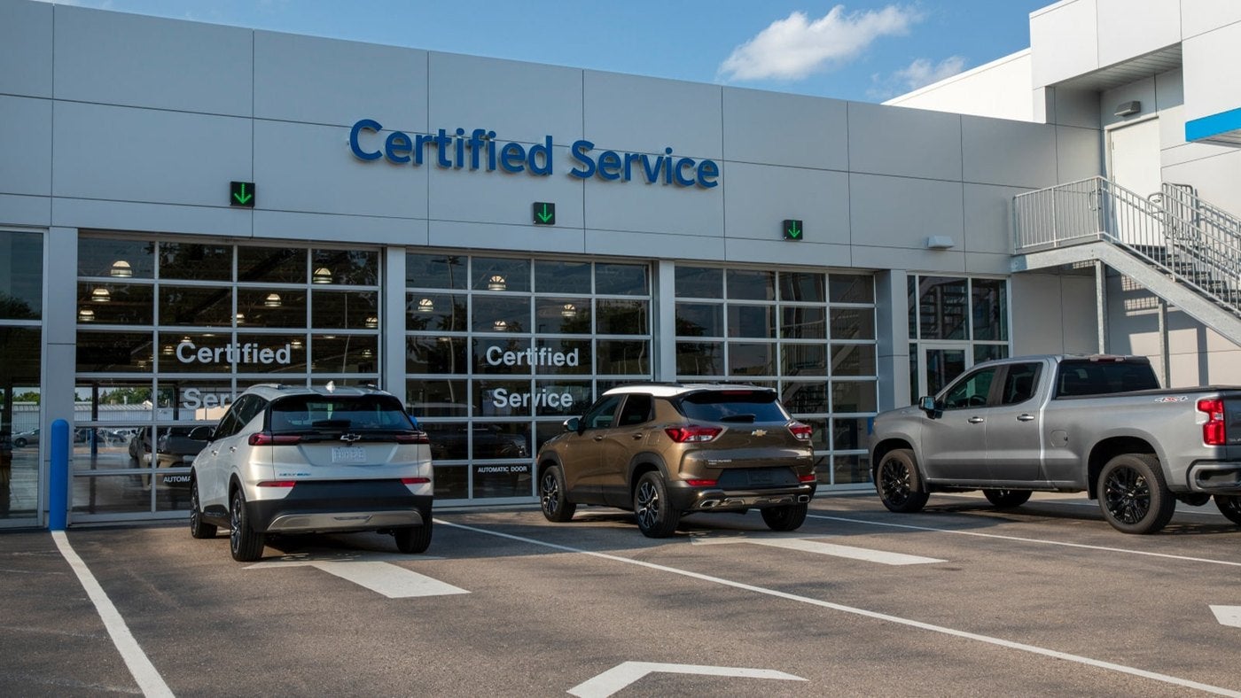 Chevrolet Certified Service building with a Bolt, Trailblazer and Silverado parked out front