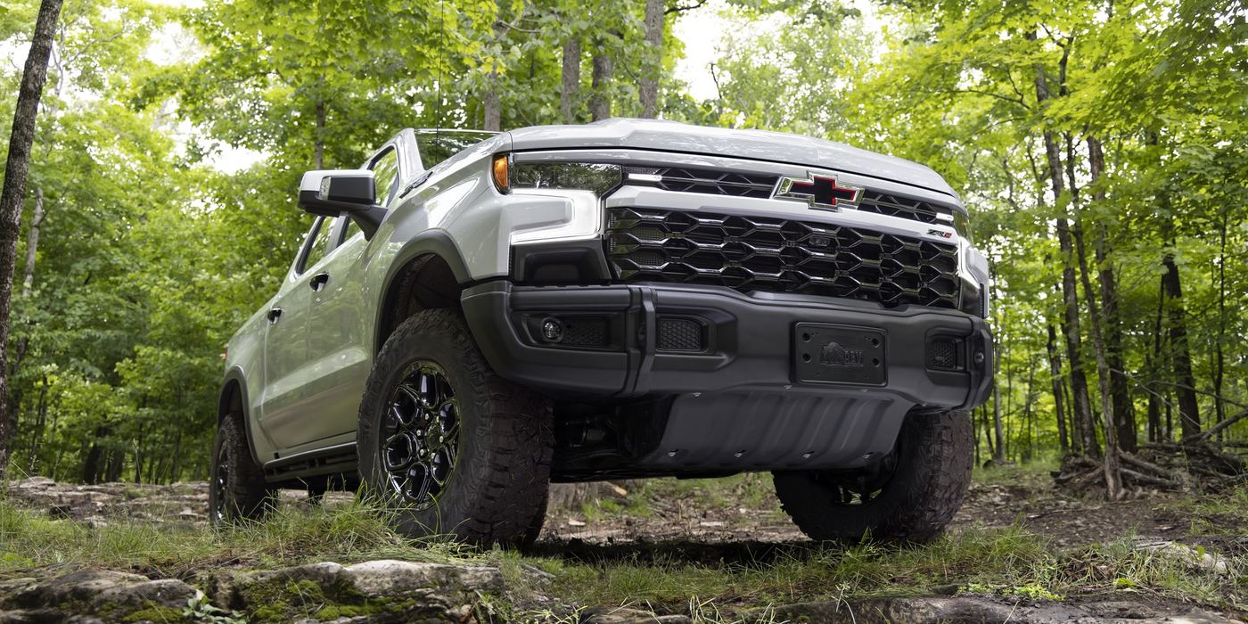 Silverado 1500 ZR2 in silver parked on a rocky forest trail, shown front on for Whitesboro, TX shoppers