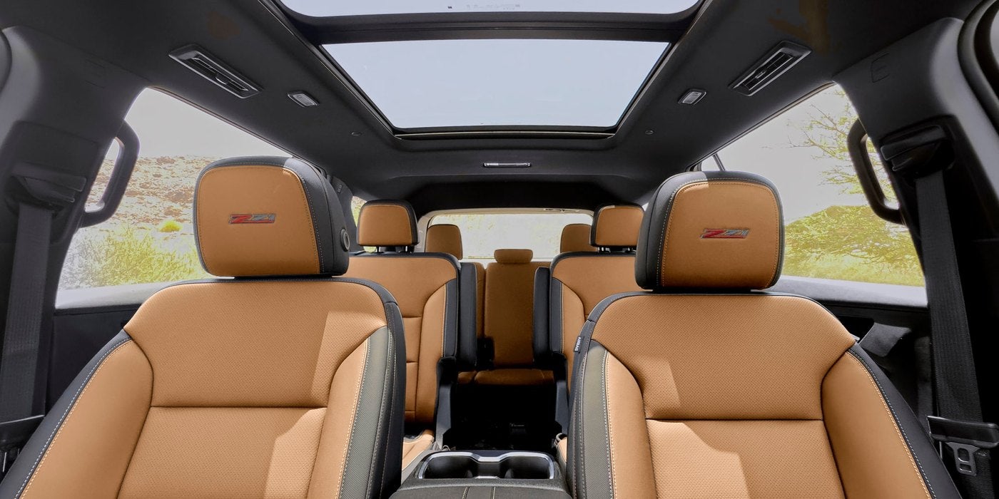 Chevrolet Traverse interior with tan leather seats across three rows under a sunroof