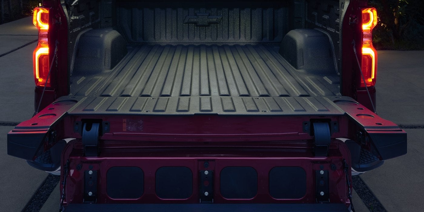 Rear view into an empty Silverado 1500 bed with the tailgate down