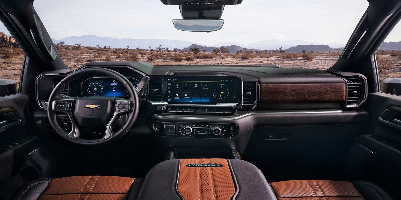 Silverado HD interior with gauge cluster, touchscreen and climate controls