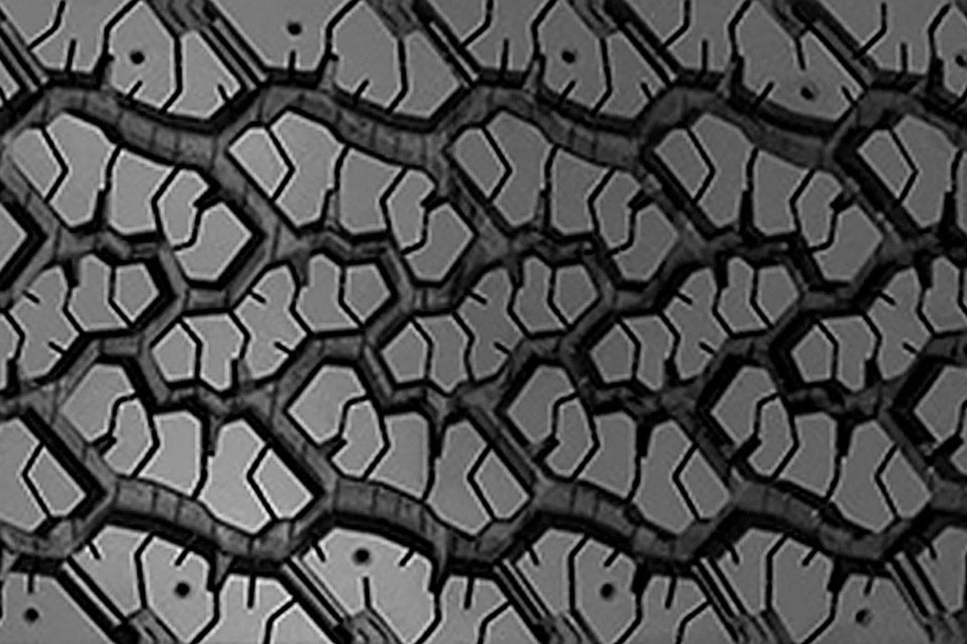 Close view of an aggressive off road tire tread pattern