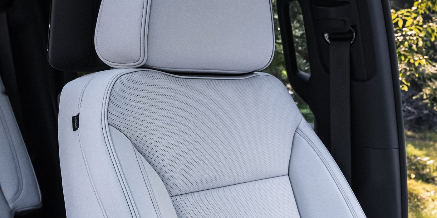 Close view of a light gray leather seat in a Chevrolet Suburban